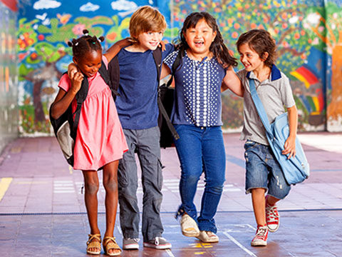group of multi-racial school children walking together